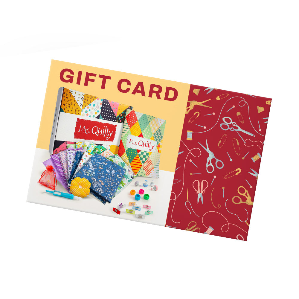 The Mrs. Quilty Gift Card features a lively quilting kit with colorful fabric swatches, thread spools, scissors, buttons, and sewing patterns set against a vibrant red and yellow background.