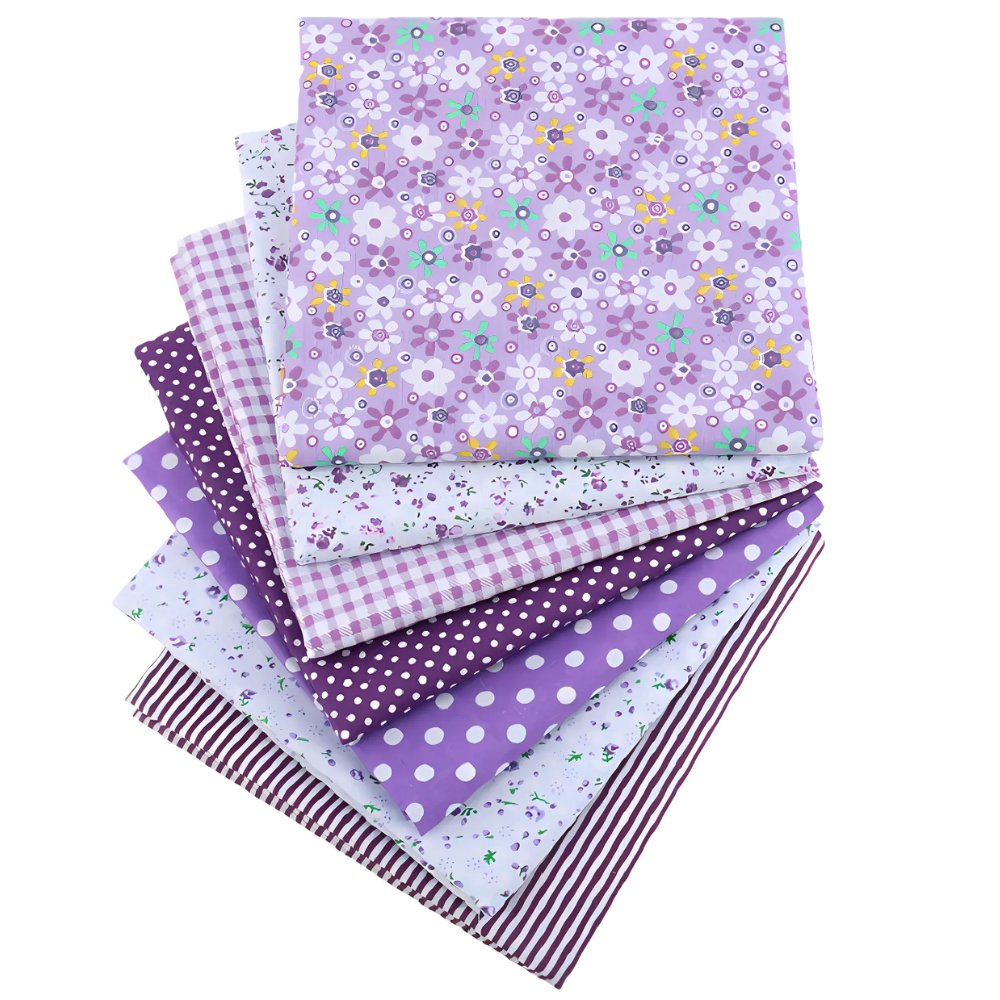 The Sunset Blooms Layer Cake Bundle includes eight pre-cut cotton squares in assorted purple patterns such as floral, polka dots, stripes, and checks.