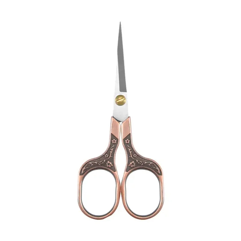 The Stainless Steel Vintage-Style Sewing Scissors boast ornate embroidery, a pointed blade, and intricate design on a white background, crafted for precision and durability.