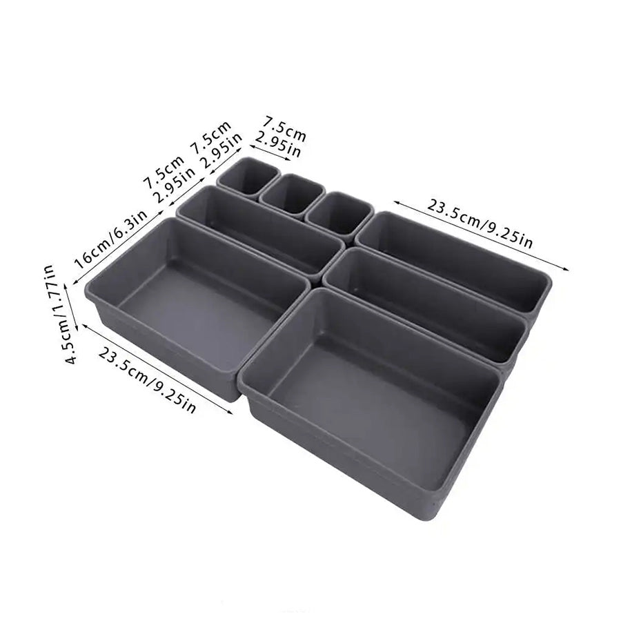 The Quilting Organizer For a Drawer is a set of black rectangular storage trays in various sizes, ideal for customizable storage. Dimensions are labeled in centimeters and inches.