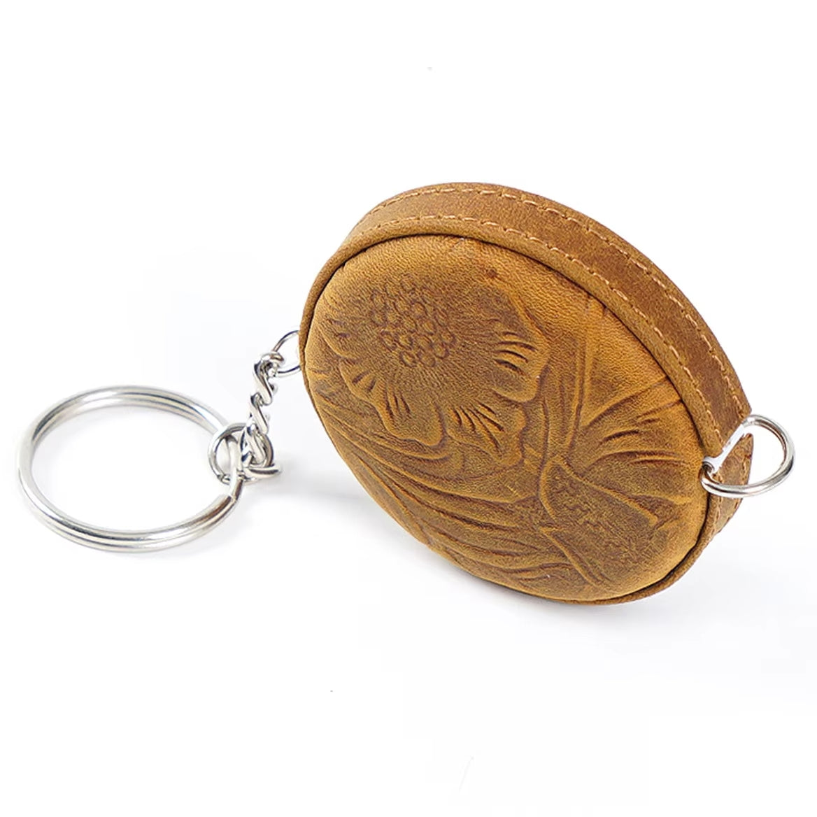 Vintage-inspired round brown keychain pouch with an embossed floral design and a silver keyring, ideal for keeping your Handmade Leather Mini Tape Measure - 59inch (150cm) close at hand.