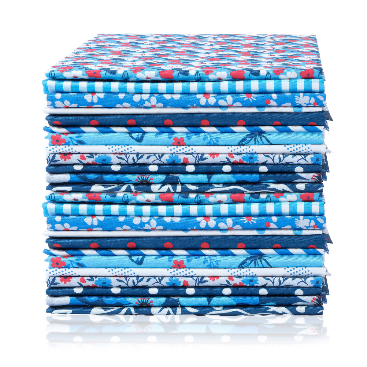A neatly stacked pile of fabric from the Vintage Garden - Fat Quarter Bundle, featuring blue-patterned quilting fabrics with designs like polka dots, stripes, and floral motifs.