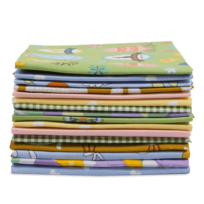 The Easter Bundle features a neatly arranged stack of vibrant, folded fabrics showcasing a variety of floral and geometric patterns against a white background.