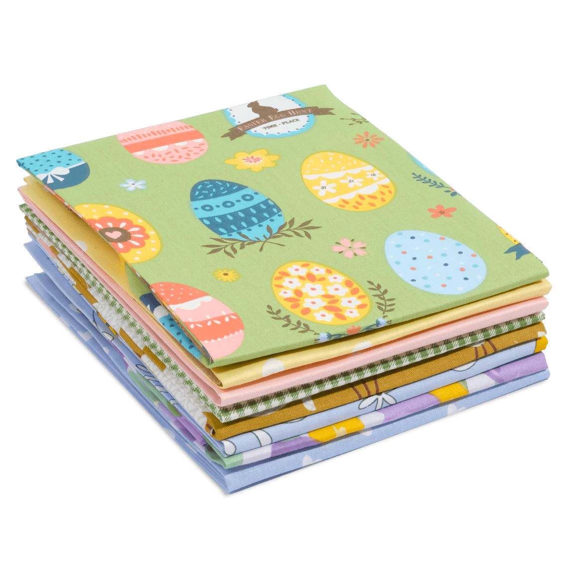 A stack of folded fabric squares from the Easter Bundle showcases various colorful patterns and designs, including Easter eggs and flowers.