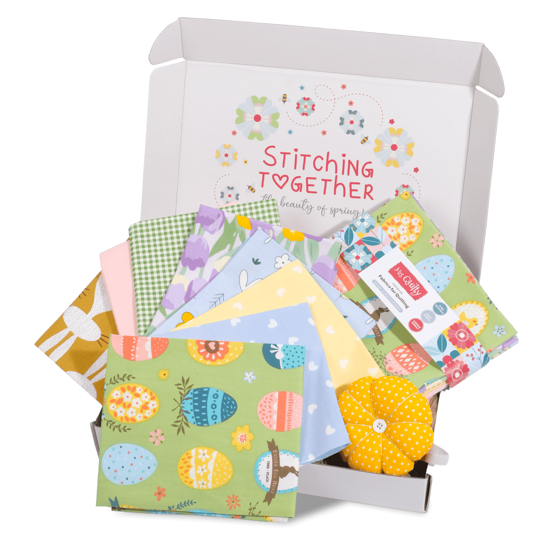 Unbox the Easter Bundle featuring vibrant fabric squares with Easter themes and a small, yellow pincushion. Branded as "Stitching Together.
