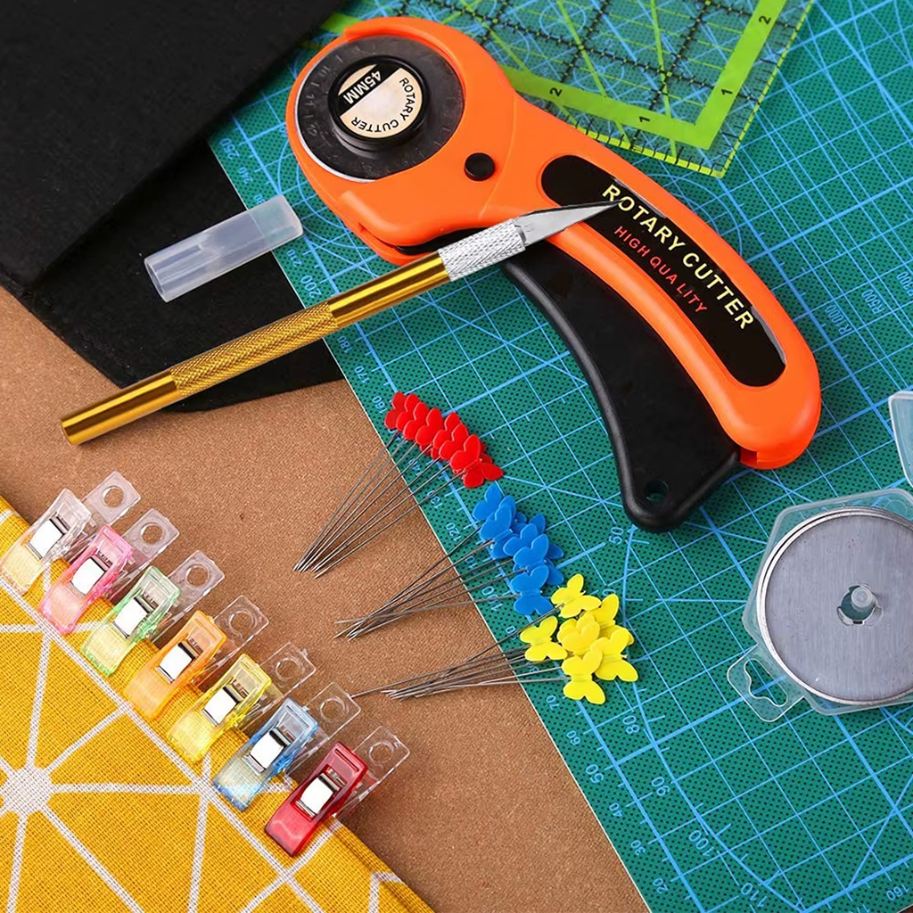 The 97-Piece Quilting Kit: Perfect for Beginners includes essential tools like a fabric cutter, craft knife, clips, pins, needles, measuring tape, and ruler—everything you need to start your quilting projects with ease.