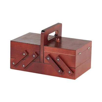 The Wooden Sewing Box with Handle (Images54) is a handcrafted pinewood storage solution with a rich brown finish, sturdy handle, and metal hinges that make it perfect for sewing supplies.