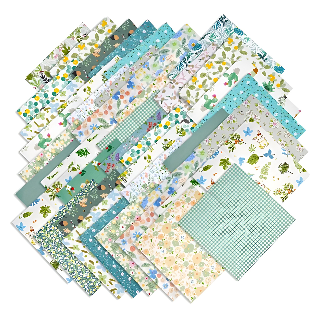 The Verdant Meadows Layer Cake Bundle offers patterned paper sheets in a fan shape, showcasing floral, leaf, and grid designs in green, blue, and neutrals—ideal for nature-inspired quilting projects.