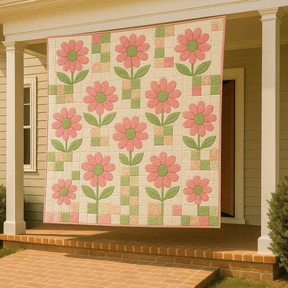 A "Bundle of 14 Quilt Patterns," featuring pink floral designs, is displayed on the front porch of a house between two white columns above a brick step.