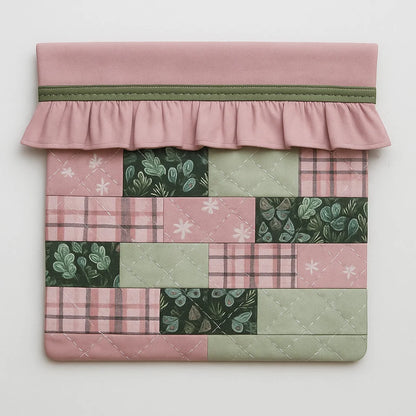 Showcase your quilting skills with the Ruffled iPad Case Downloadable PDF Quilt Pattern—a lively patchwork design with pink, green, floral squares, a pink ruffled flap, and green trim. Perfect for intermediate quilters!.