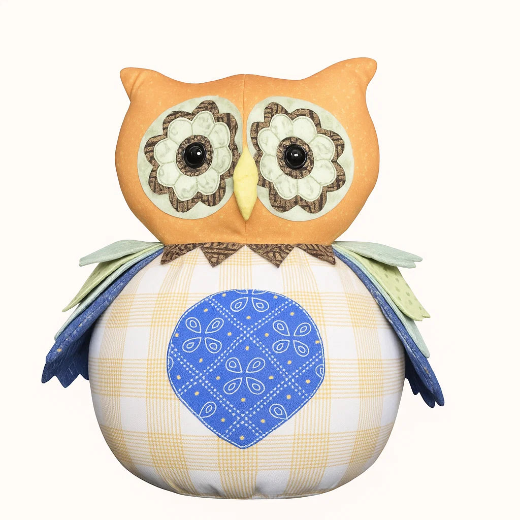 Plush owl toy with a blue bandana on a white background