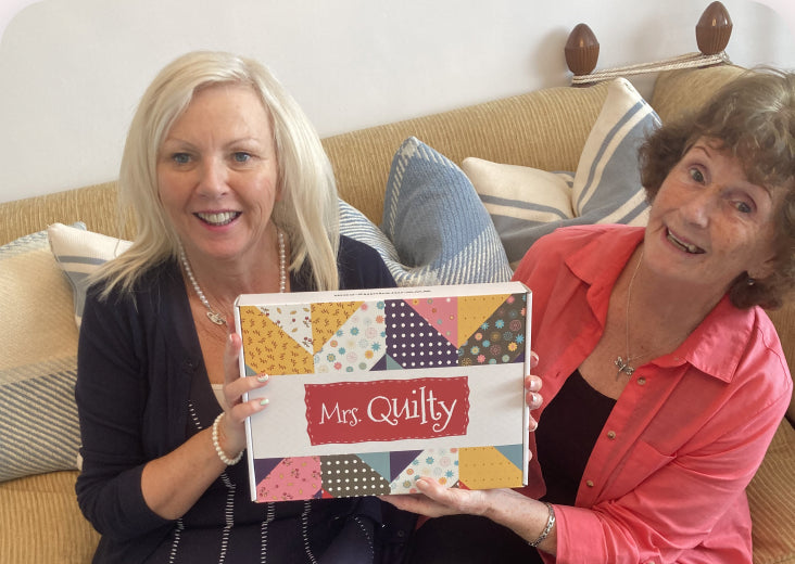 Beth and a friend with their Mrs. Quilty box